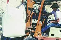 Photo of mineral being loaded with a fork lift.